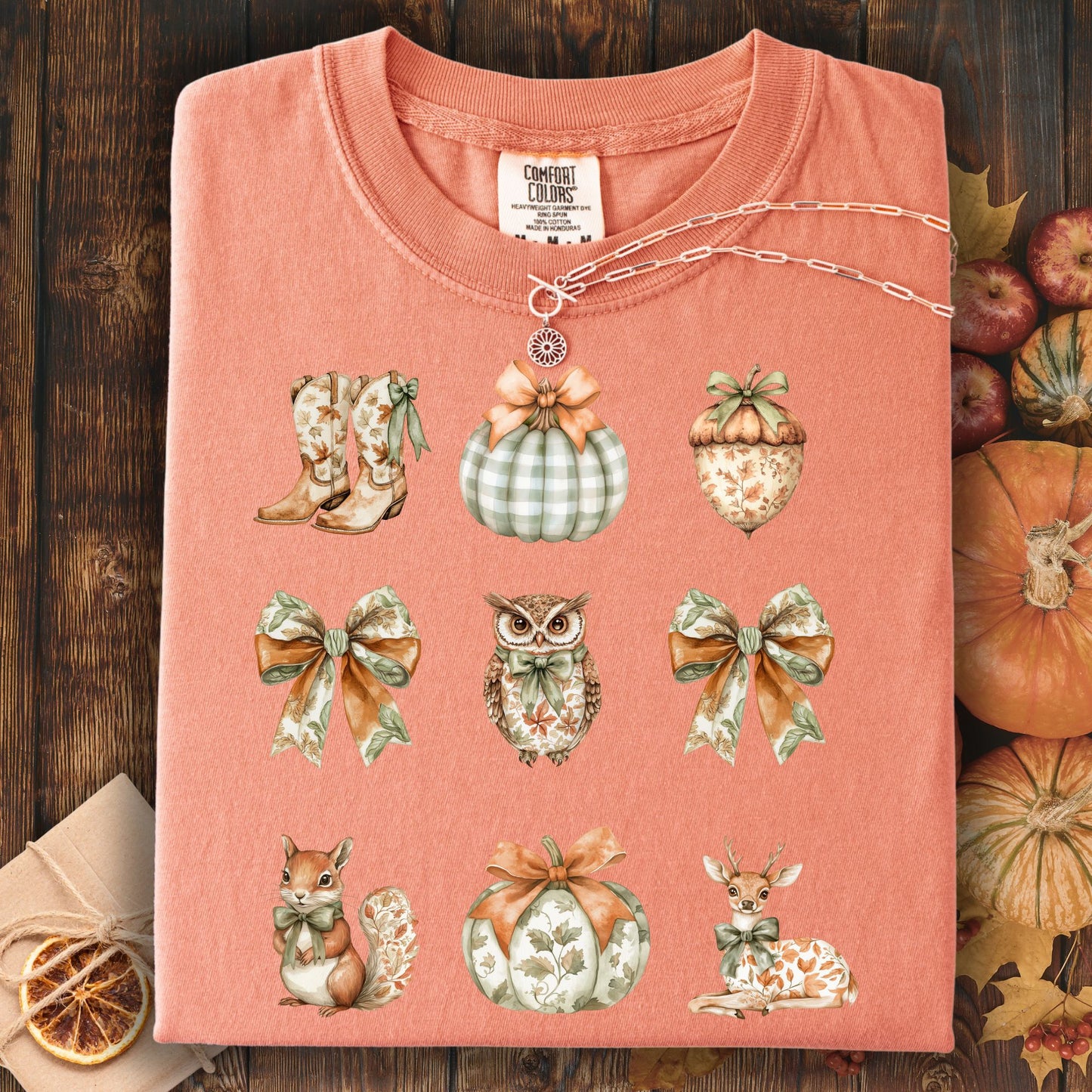 Terracotta cotton t-shirt with boho fall artwork: bows, pumpkins, acorn, owl, squirrel, and deer.