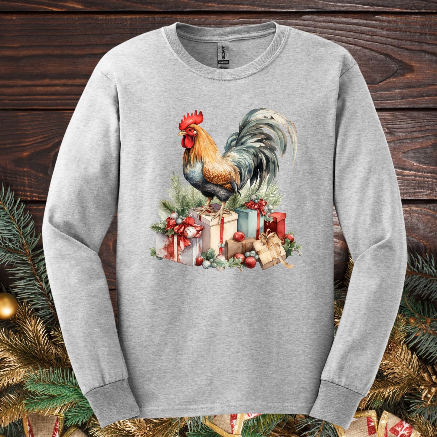 Ash Gildan long sleeve tee with a watercolor Christmas rooster on festive presents.