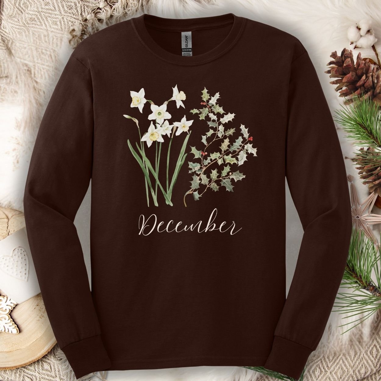 Dark chocolate long sleeve tee with watercolor narcissus and holly berry design, "December" script.