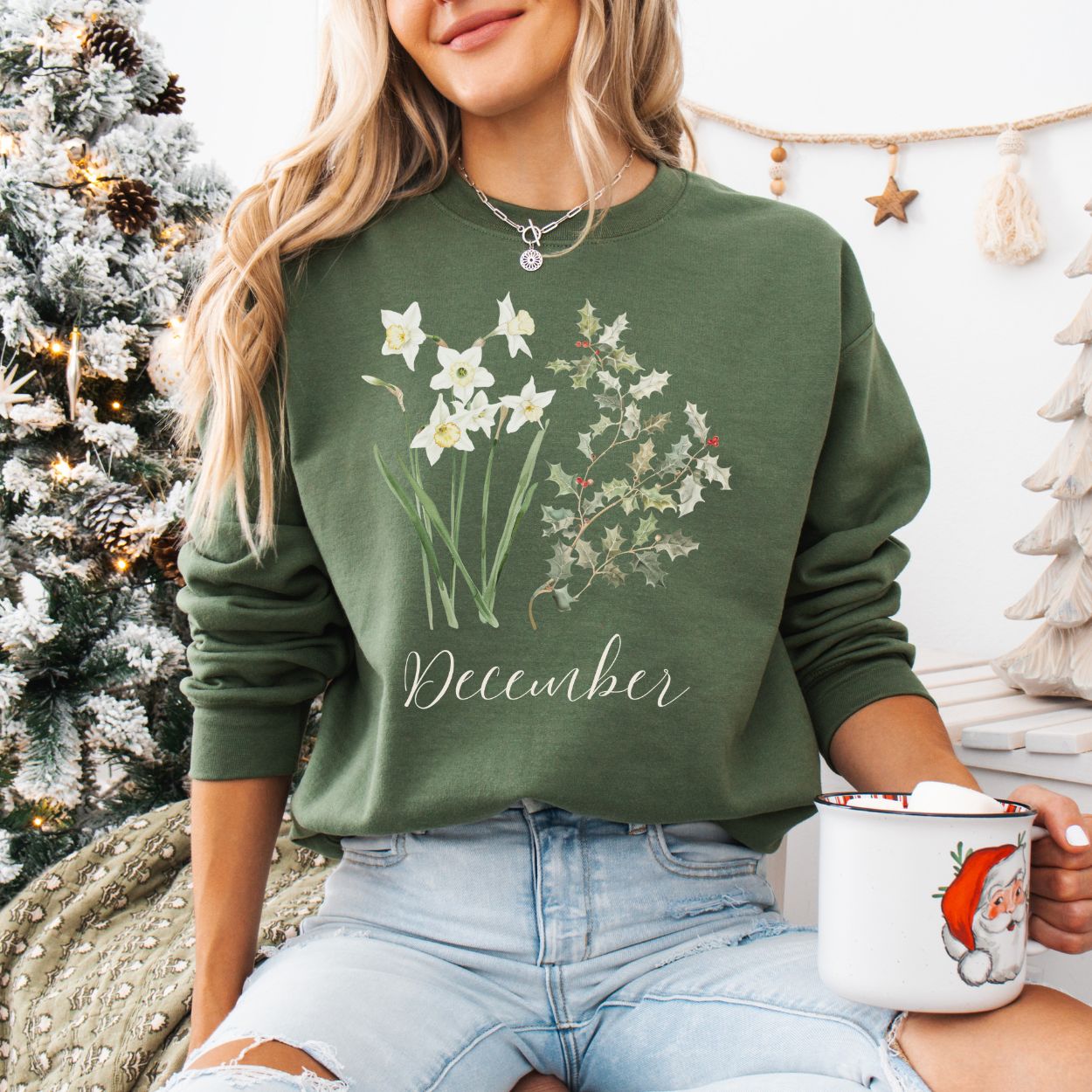 Olive green unisex sweatshirt with white narcissus, holly berry design, and "December" script.