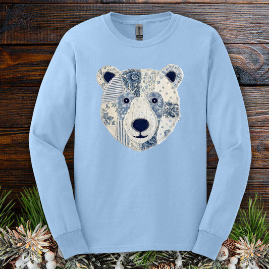 Light blue long sleeve tee with a faux patchwork winter bear face design.