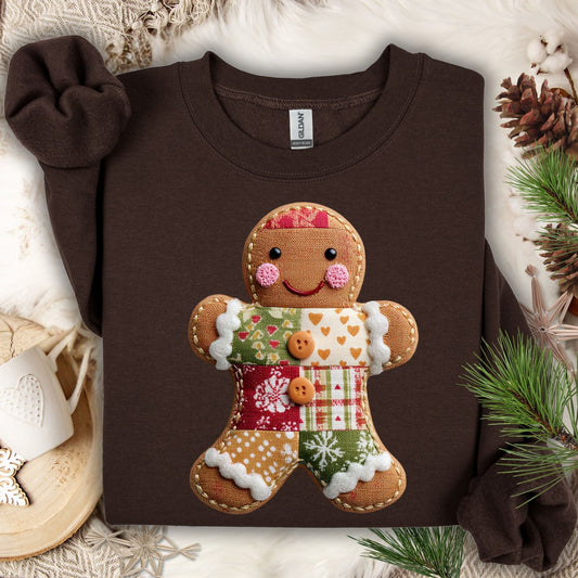 Dark Chocolate Gildan sweatshirt with a vintage-style faux patchwork gingerbread man graphic.