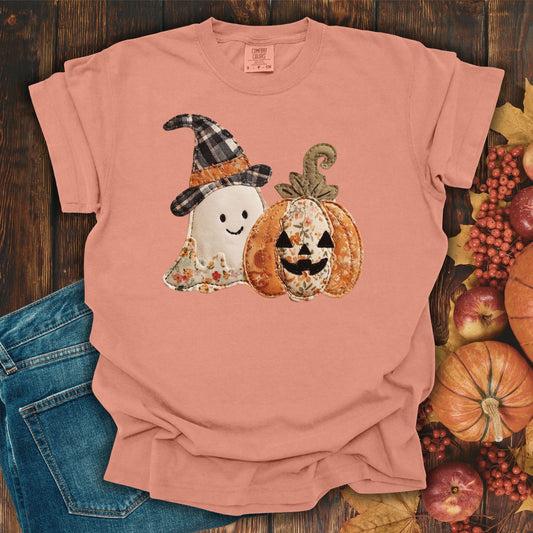 Terracotta Comfort Colors t-shirt with a faux patchwork ghost in a plaid witch hat and a floral jack o'lantern.