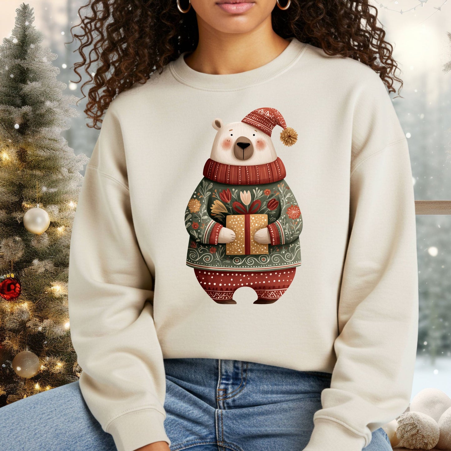 Cream Gildan sweatshirt with a folk art polar bear in a fair isle sweater, holding a Christmas gift.