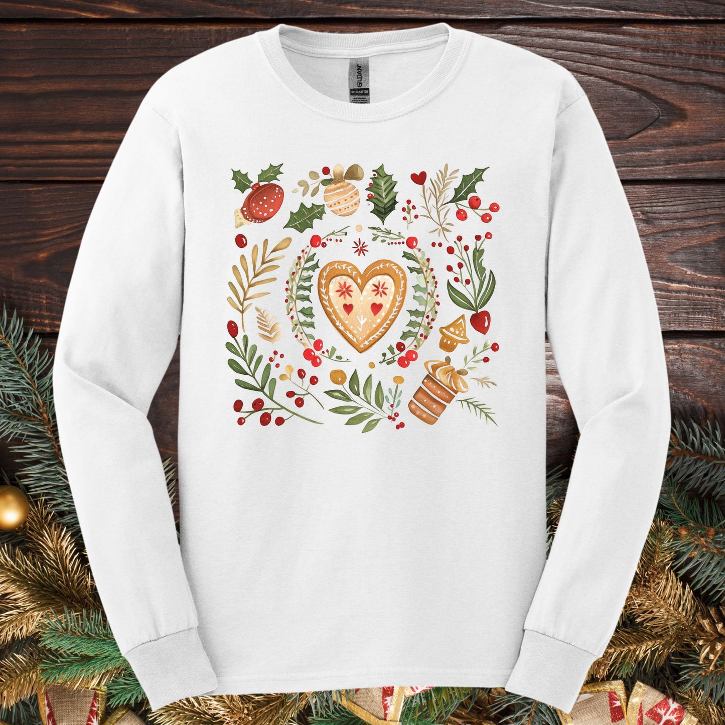 White Gildan Softstyle long sleeve tee with folk art gingerbread heart, holly, and vintage baking design.
