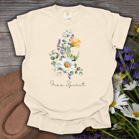 Ivory S t-shirt with a hand-painted botanical bouquet of daisies, lavender, and eucalyptus, above "Free Spirit" script.