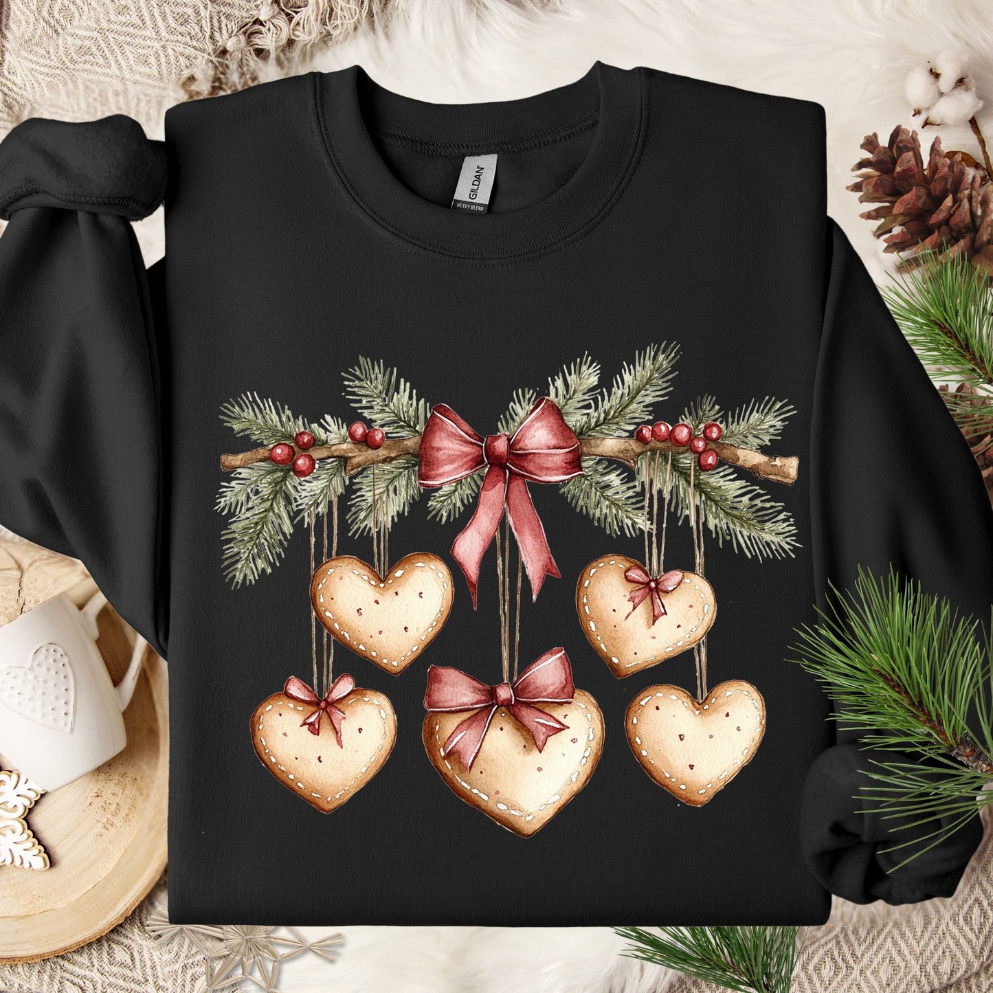 Black cotton-poly fleece sweatshirt with watercolor evergreen garland and gingerbread heart cookies.