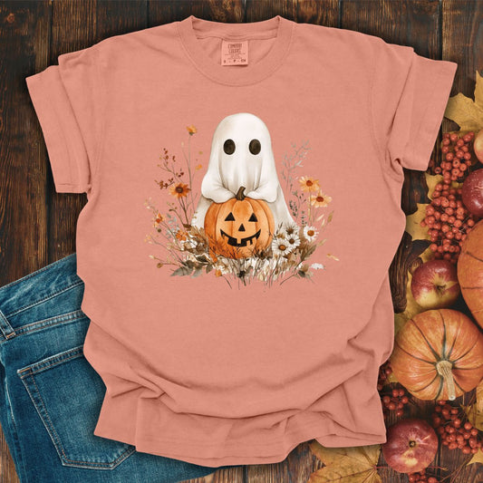 Terracotta Halloween Boho Ghost T-shirt with Jack O'Lantern, pumpkins, and autumn florals, on a wooden background.