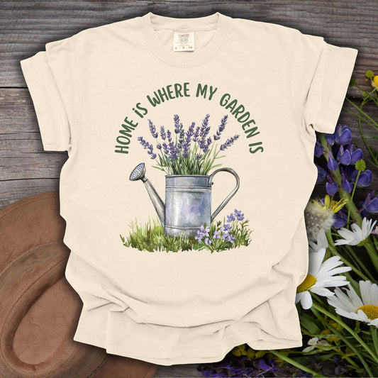 Ivory S t-shirt with a watercolor watering can overflowing with lavender and "Home Is Where My Garden Is" text.