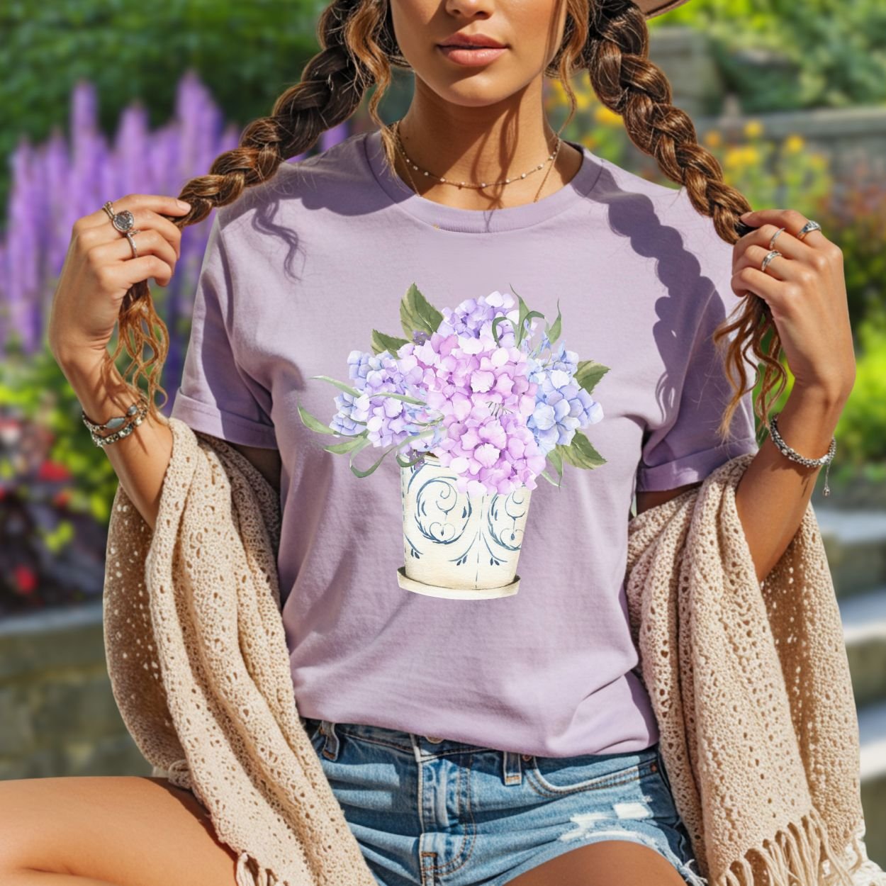 Garment-dyed lilac t-shirt with a watercolor hydrangea bouquet in a vintage ceramic vase.