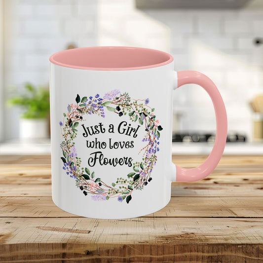 White 11oz mug with pink interior/handle, "Just a Girl who Loves Flowers" in a watercolor floral wreath.