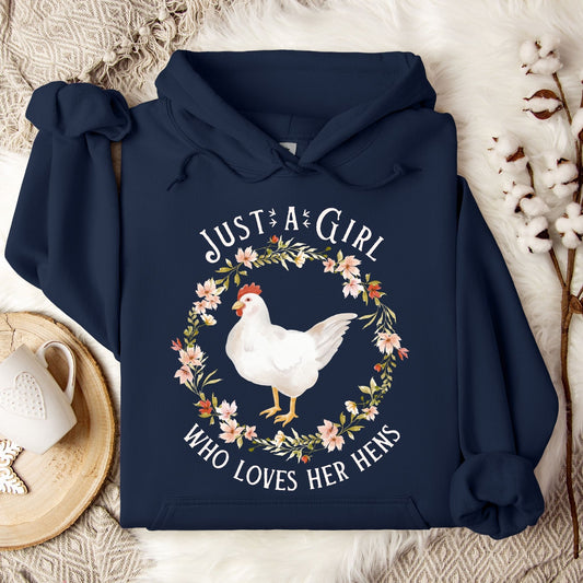 Navy cotton-polyester hoodie with "Just a Girl Who Loves Her Hens" text and watercolor chicken in floral wreath.