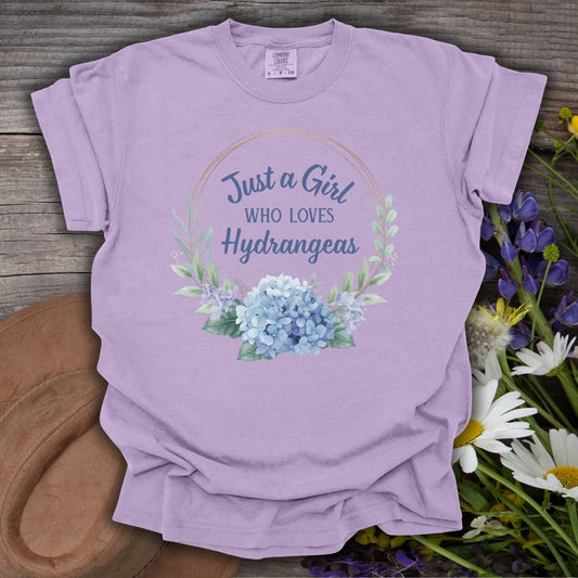 Orchid garment-dyed cotton t-shirt with "Just a Girl Who Loves Hydrangeas" in a watercolor floral wreath.