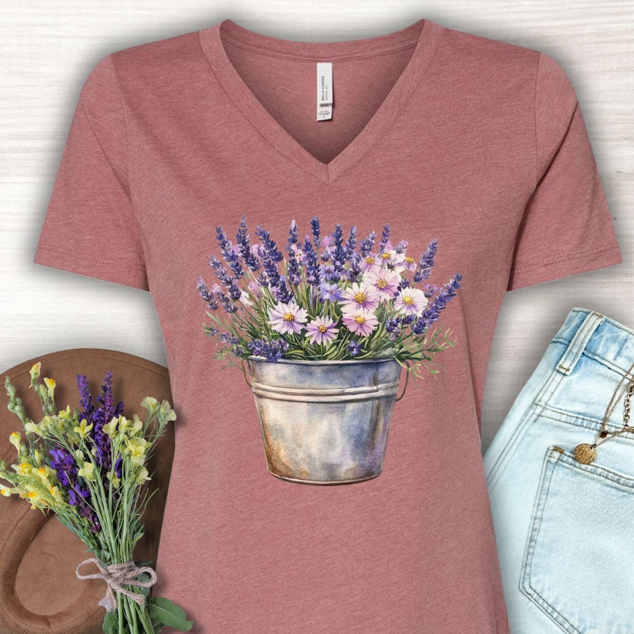 Heather Mauve v-neck tee with a faded botanical print of lavender and daisies in a rustic metal pot.