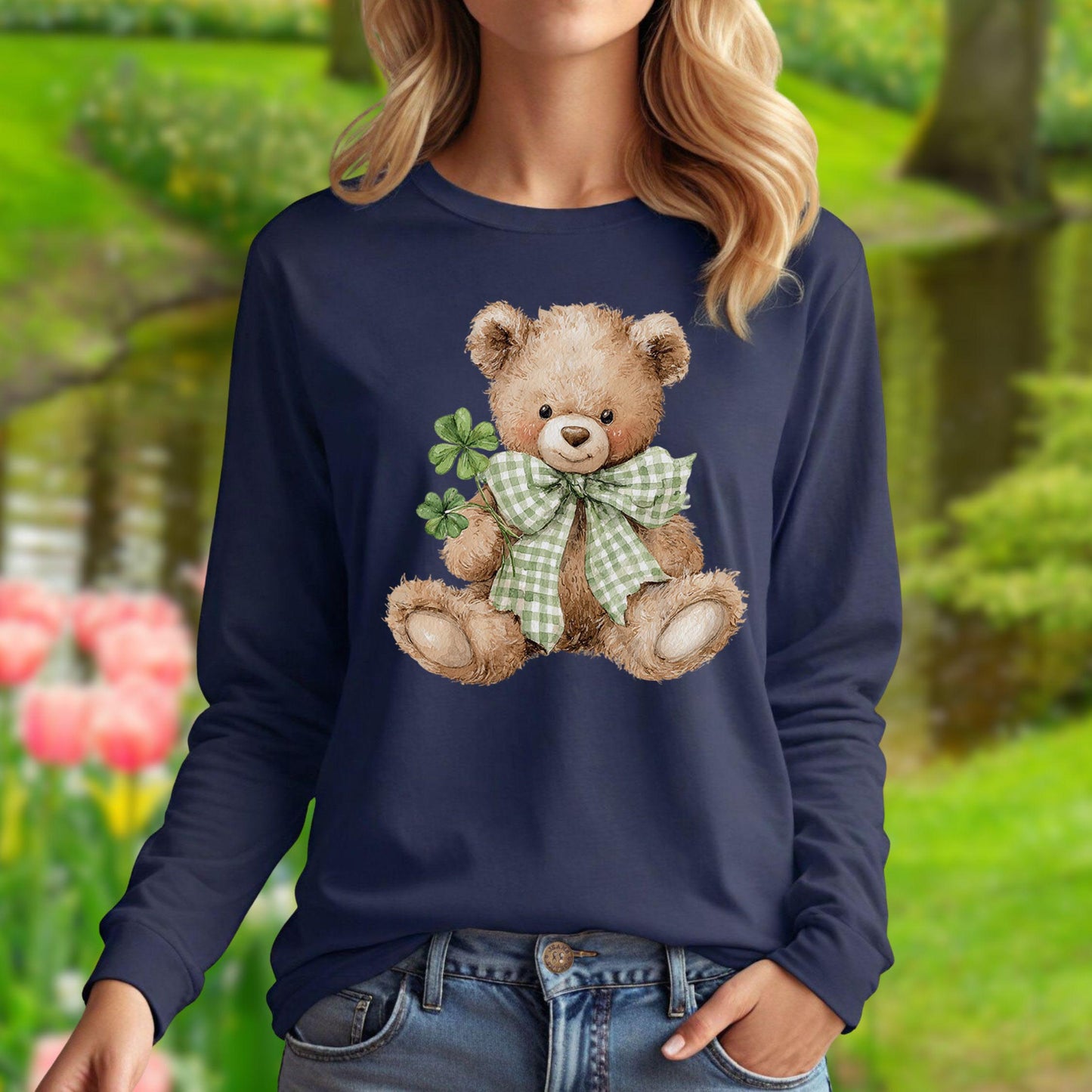 Watercolor teddy bear with green checkered bow and four-leaf clovers on a navy long-sleeve tee.
