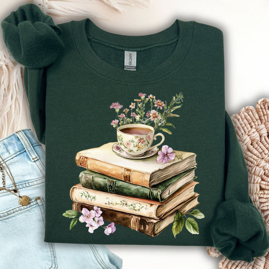 Forest Green crewneck sweatshirt with a vintage illustration of stacked books, a floral teacup, and greenery.