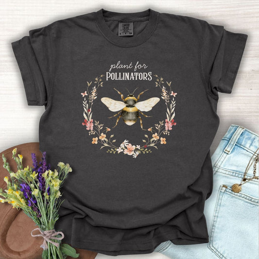Pepper S cotton t-shirt with a hand-painted bumblebee in a floral wreath and "Plant for Pollinators" text.