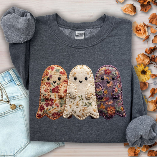 Dark Heather S sweatshirt with three floral fabric ghosts, styled with jeans and autumn leaves.