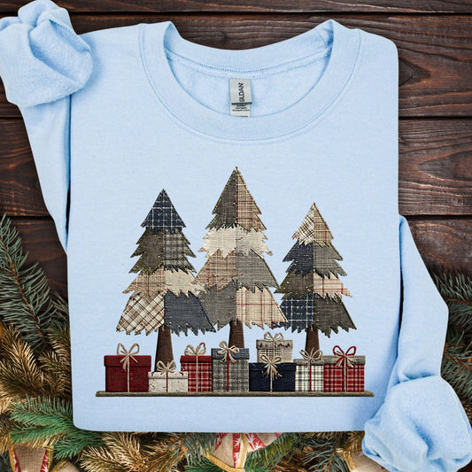 Light blue Gildan sweatshirt with faux patchwork rustic Christmas trees and gifts.