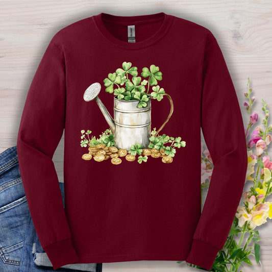Maroon long sleeve tee with a watercolor watering can, shamrocks, and gold coins design.