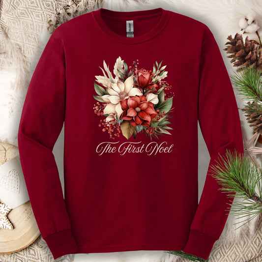Cardinal Red Gildan long sleeve tee with a watercolor Christmas bouquet and "The First Noel" text.