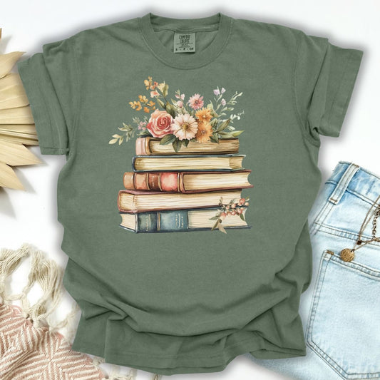 Moss green S-size t-shirt with a vintage books and summer flowers graphic.