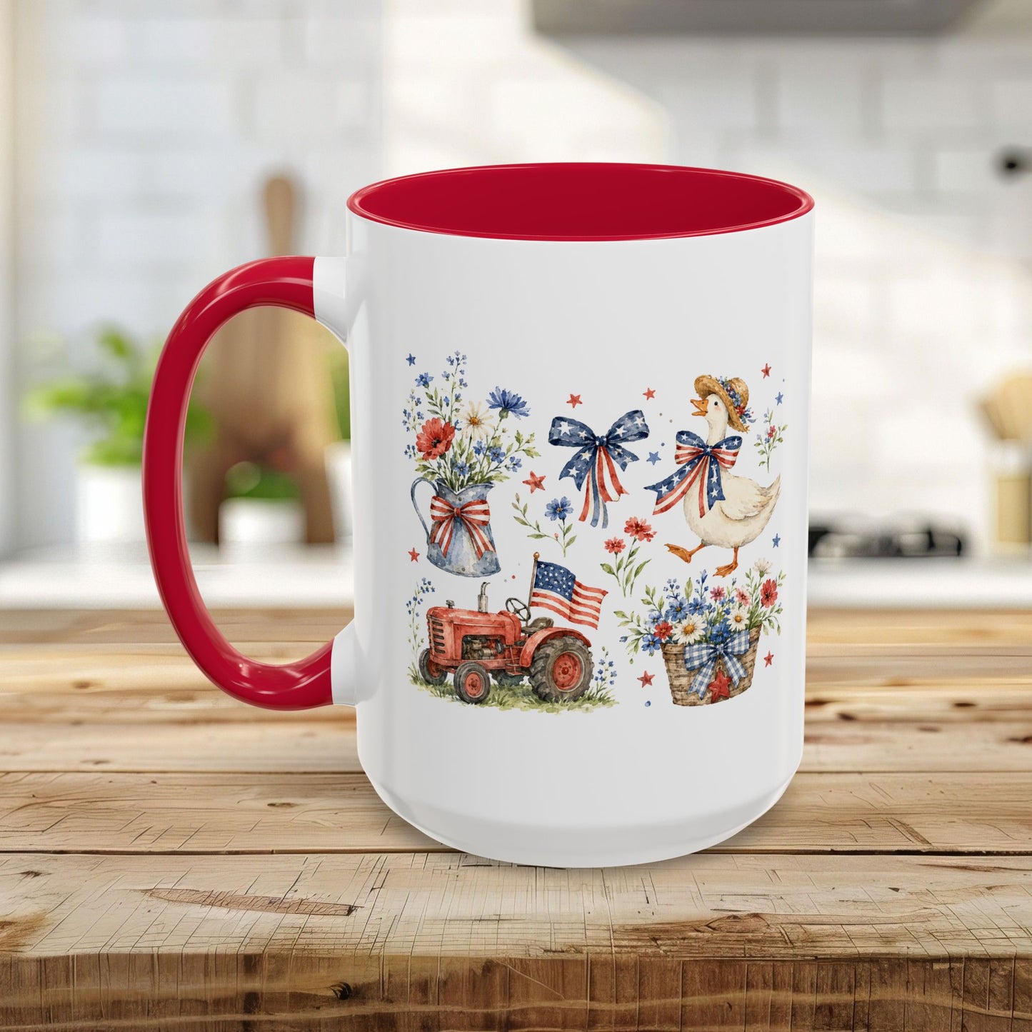 White ceramic mug with red handle and interior, featuring a patriotic farmhouse design with a goose, tractor, and wildflowers.