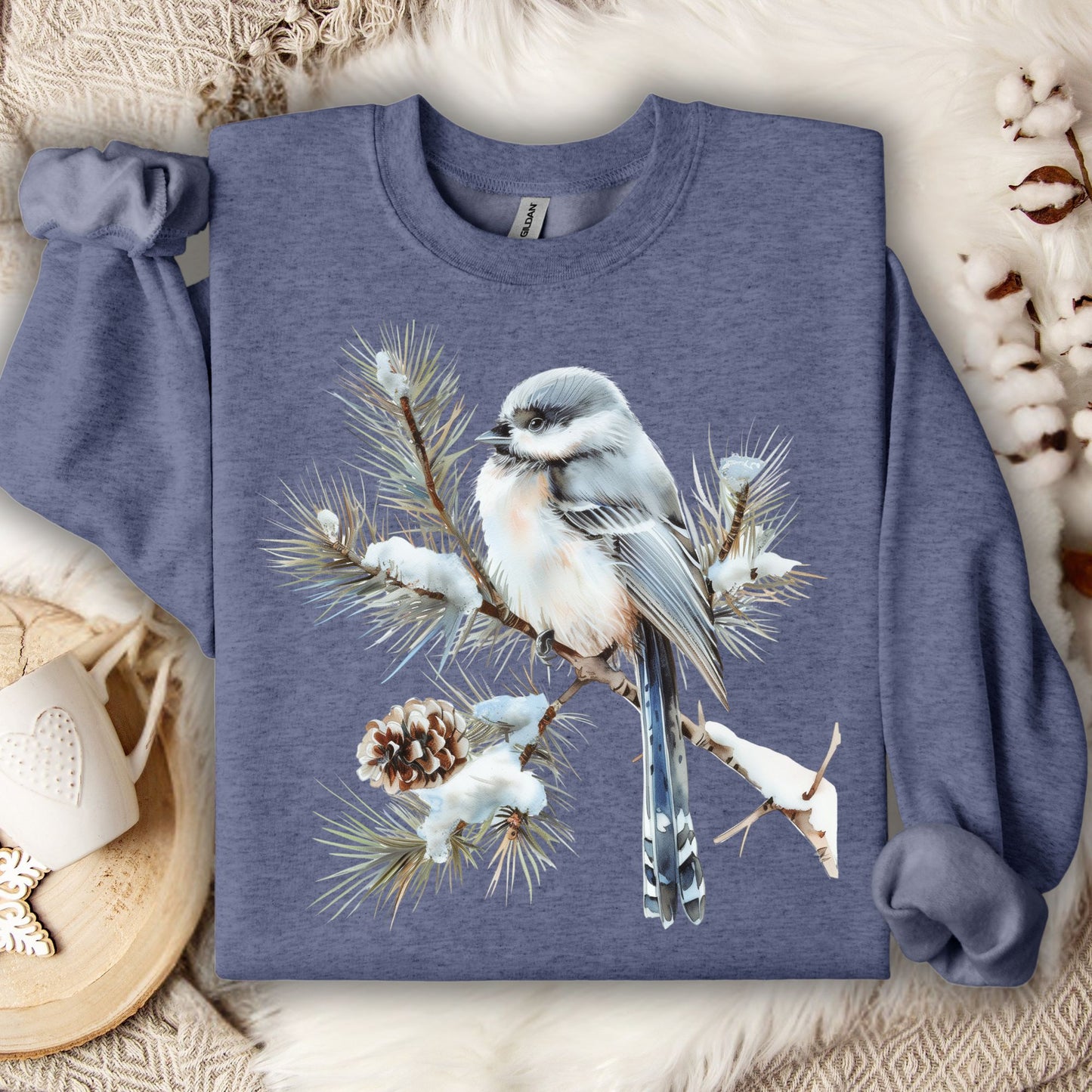 Heather Sport Dark Navy Gildan 18000 sweatshirt with a watercolor long-tailed tit on a snowy evergreen bough.