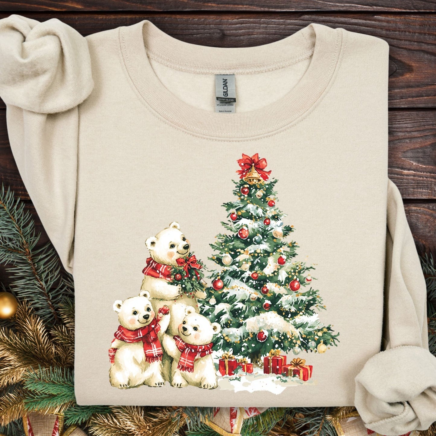 Sand Gildan 18000 sweatshirt with watercolor polar bears trimming a snowy Christmas tree.
