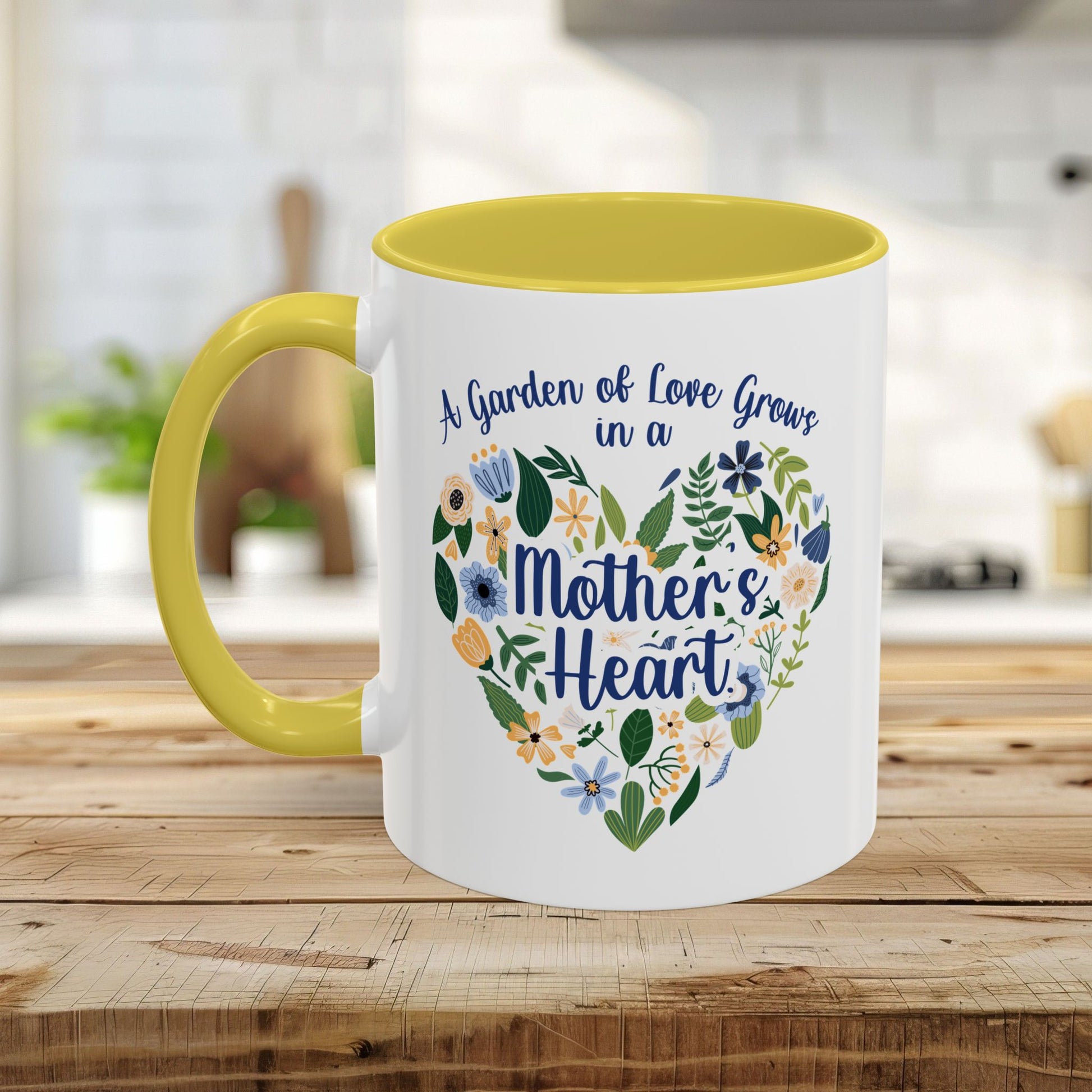 White ceramic mug with yellow handle and interior, featuring a floral heart design and "A garden of love grows in a Mother's Heart" text.