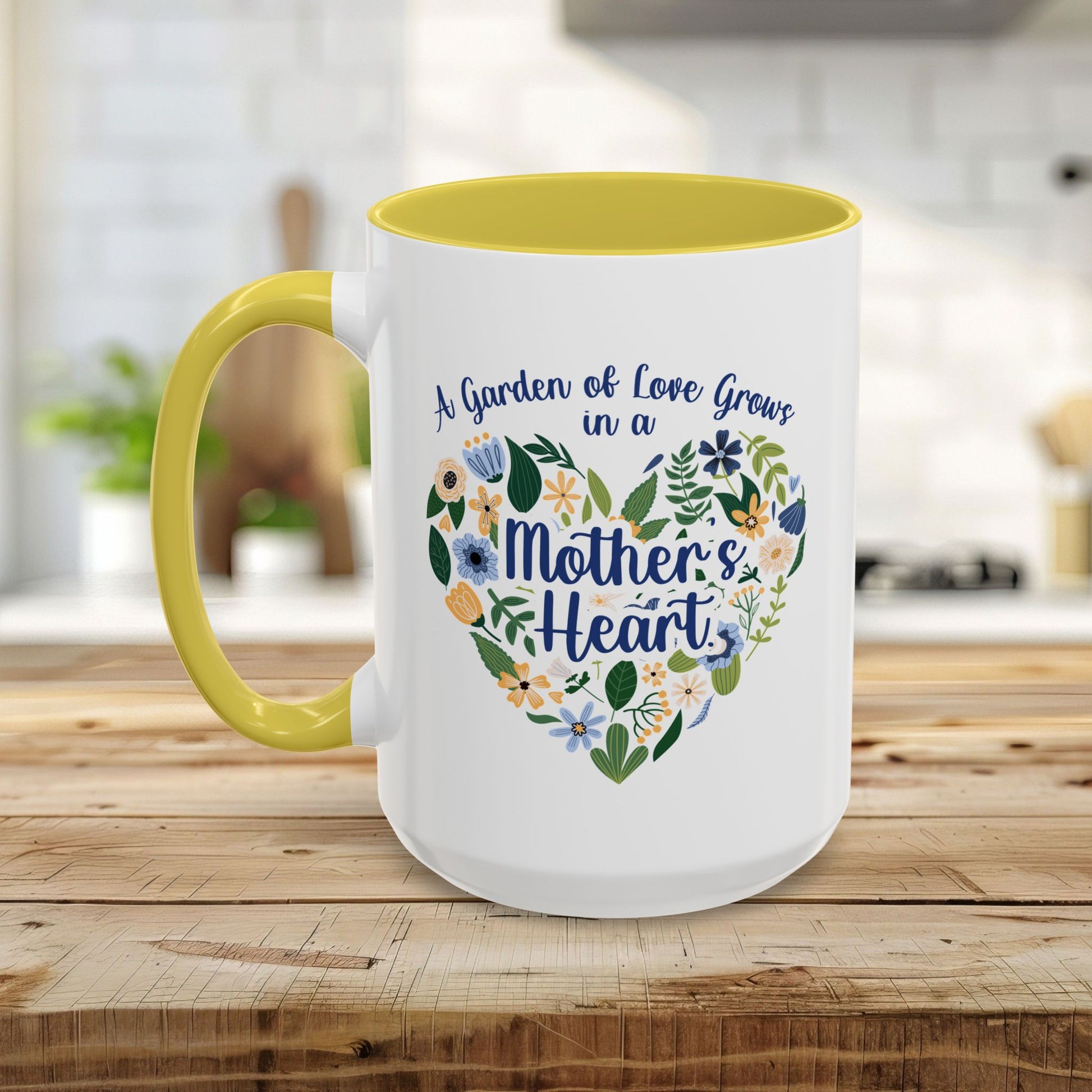 White ceramic mug with yellow handle and interior, featuring a floral heart design and "A Garden of Love Grows in a Mother's Heart" text.