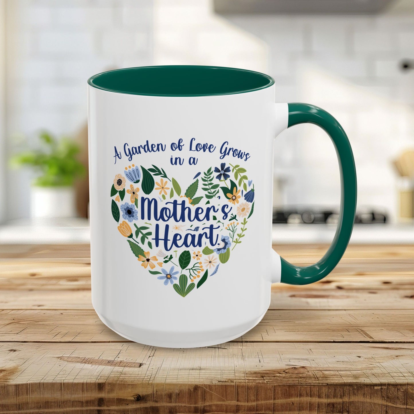White 15oz ceramic mug with green handle and interior, featuring a floral heart and "A Garden of Love Grows in a Mother's Heart.