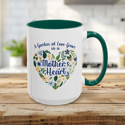 White 15oz ceramic mug with green handle and interior, featuring a floral heart and "A Garden of Love Grows in a Mother's Heart.