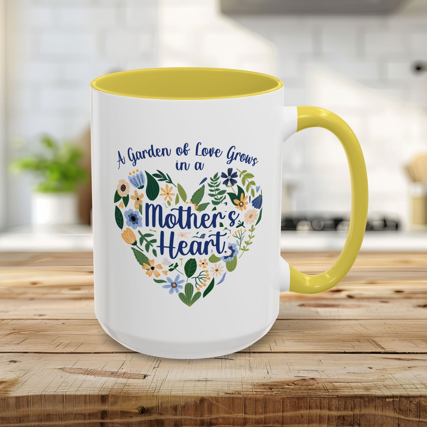 15oz white ceramic mug with yellow handle/interior, floral heart design, and "A Garden of Love Grows in a Mother's Heart" text.