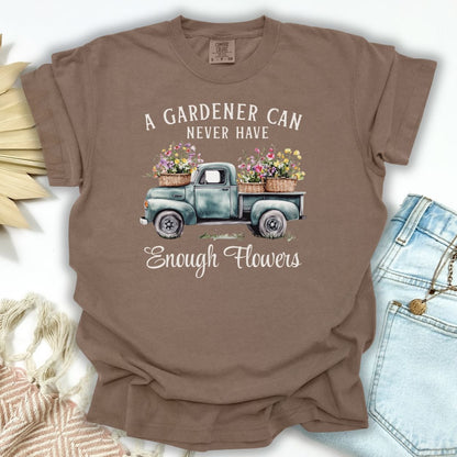 Espresso brown cotton t-shirt with a vintage watercolor pickup truck spilling flowers and "A gardener can never have enough flowers" text.