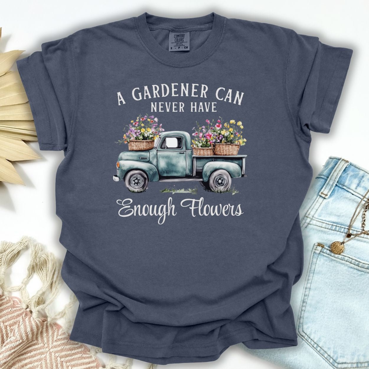 Denim S-size t-shirt with a vintage watercolor pickup truck overflowing with flowers and a gardening quote.
