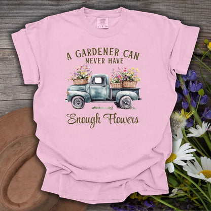 Blossom pink cotton t-shirt with a vintage watercolor pickup truck spilling flowers and "A gardener can never have enough flowers" text.
