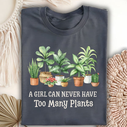 Dark Heather S-size t-shirt with "A Girl Can Never Have Too Many Plants" text and watercolor houseplant art.