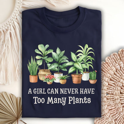 Navy S-size t-shirt with "A Girl Can Never Have Too Many Plants" text and watercolor houseplant art.