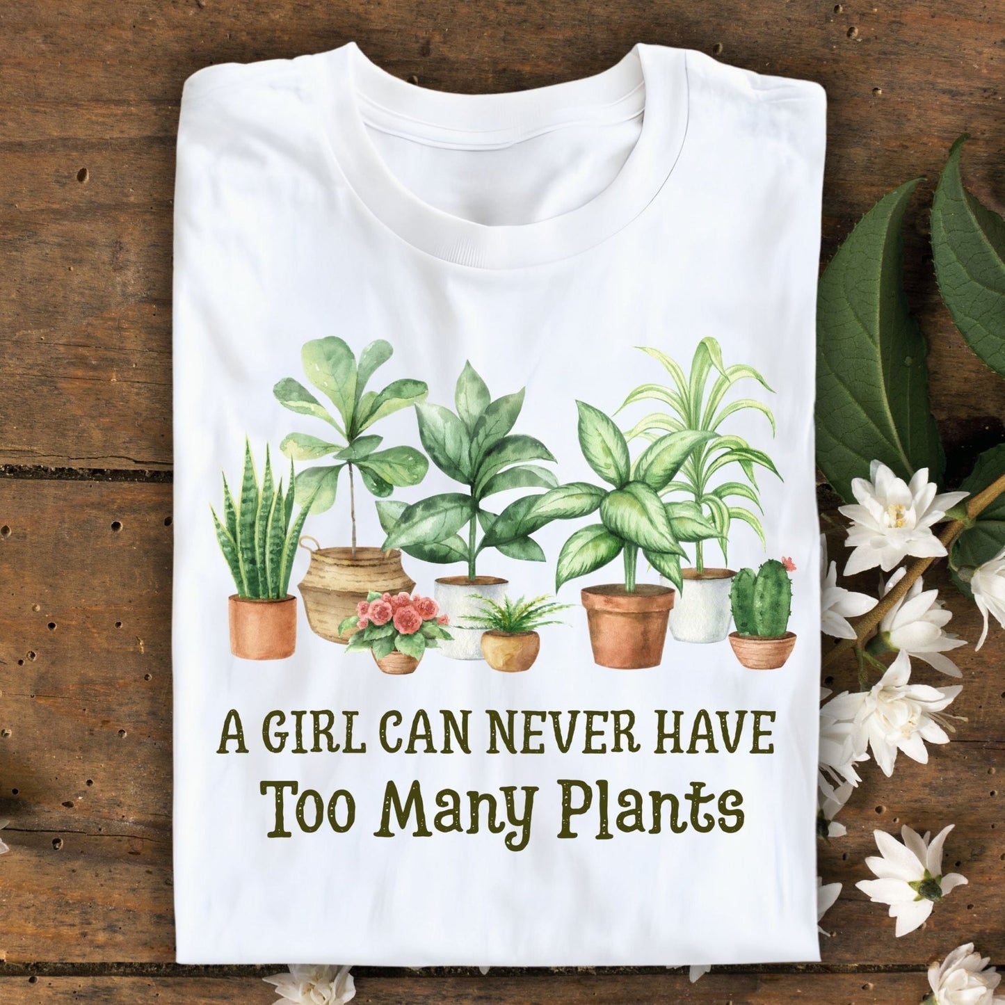 White S-size t-shirt with "A Girl Can Never Have Too Many Plants" text and watercolor houseplant art.