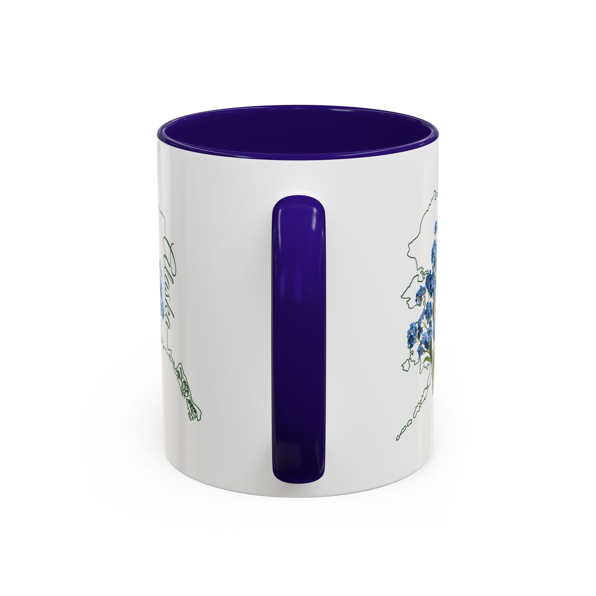 White ceramic mug with purple interior and handle, featuring a green outline of Alaska and blue forget-me-not flowers.