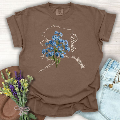 Espresso S t-shirt with white Alaska outline, blue forget-me-not flowers, and "Alaska" script.