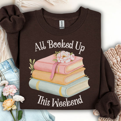 Dark chocolate crewneck sweatshirt with "All Booked Up This Weekend" and watercolor stack of books.
