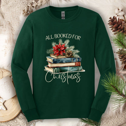 Forest Green long sleeve tee with vintage watercolor books, poinsettia, and "All Booked for Christmas" text.