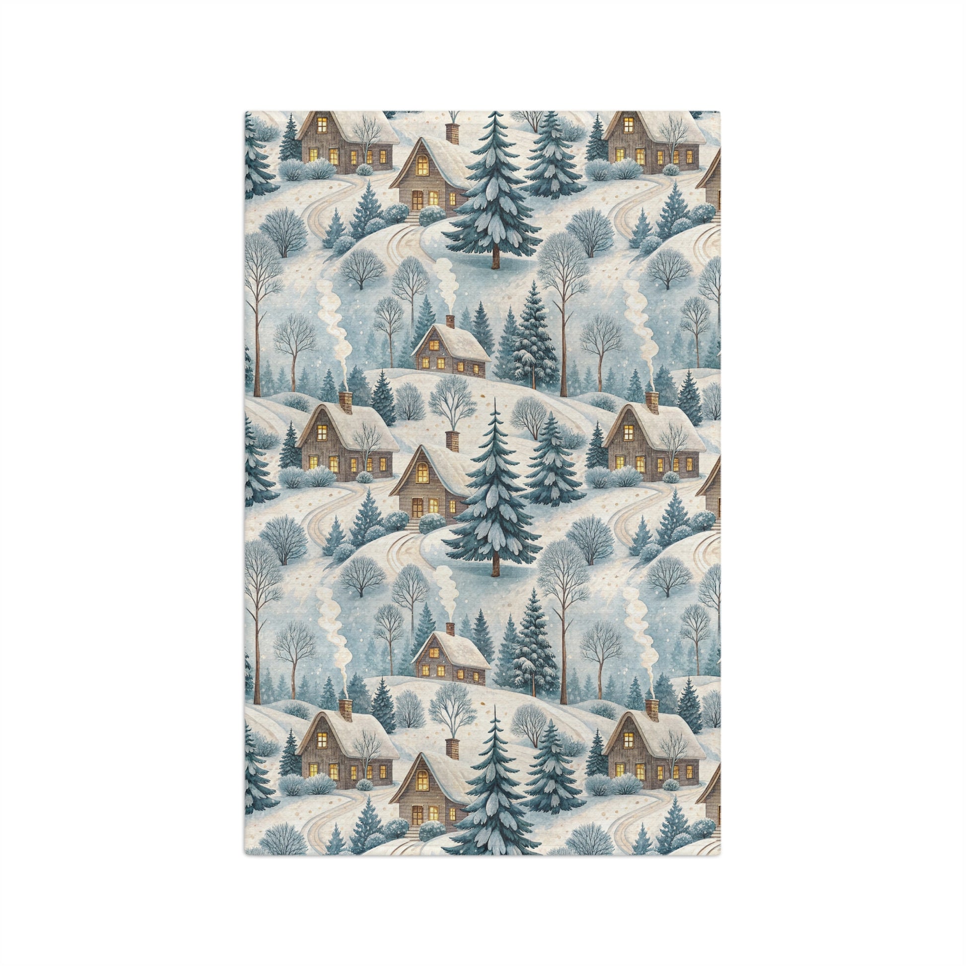 Microfiber tea towel with a muted blue and ochre Alpine winter village scene, featuring cozy cottages and frosted pines.