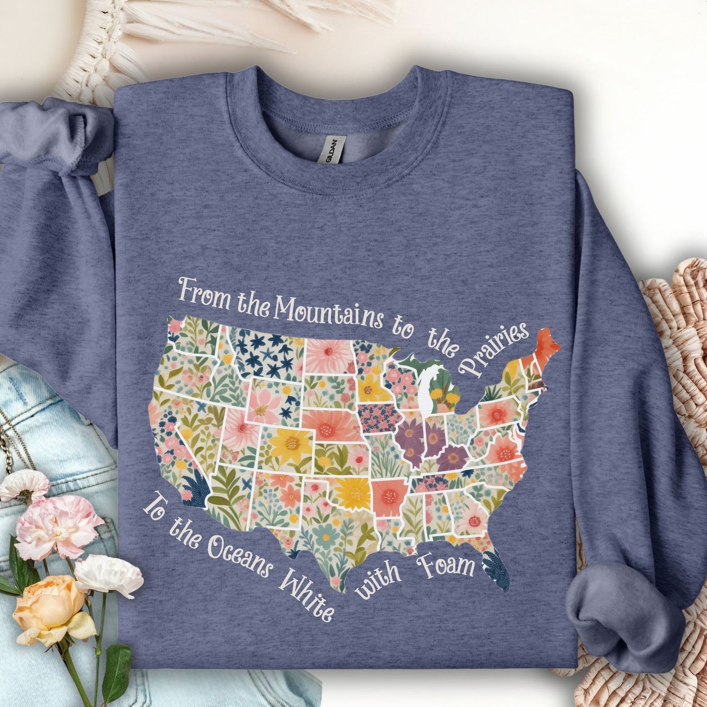 Heather Sport Dark Navy sweatshirt with a floral US map and "From the Mountains to the Prairies..." text.