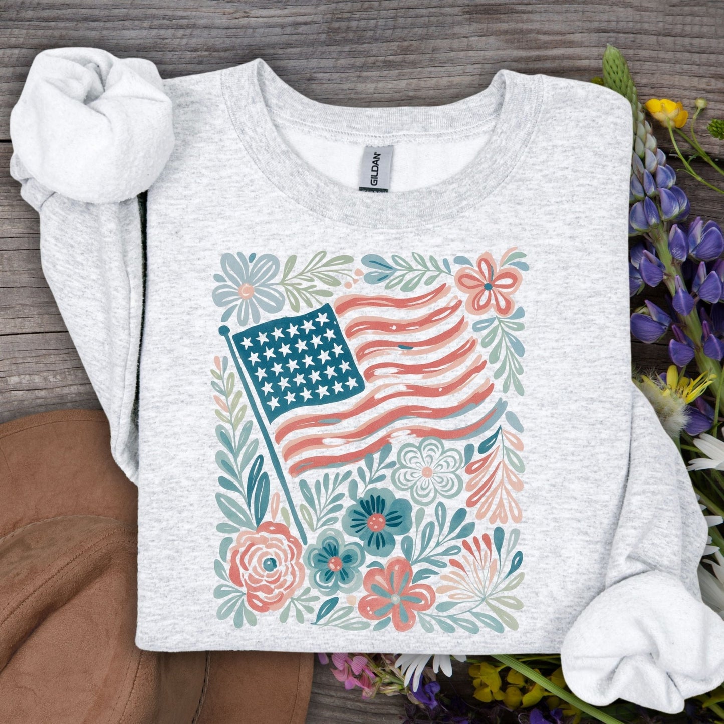 Ash gray Gildan sweatshirt with watercolor American flag and delicate flowers.