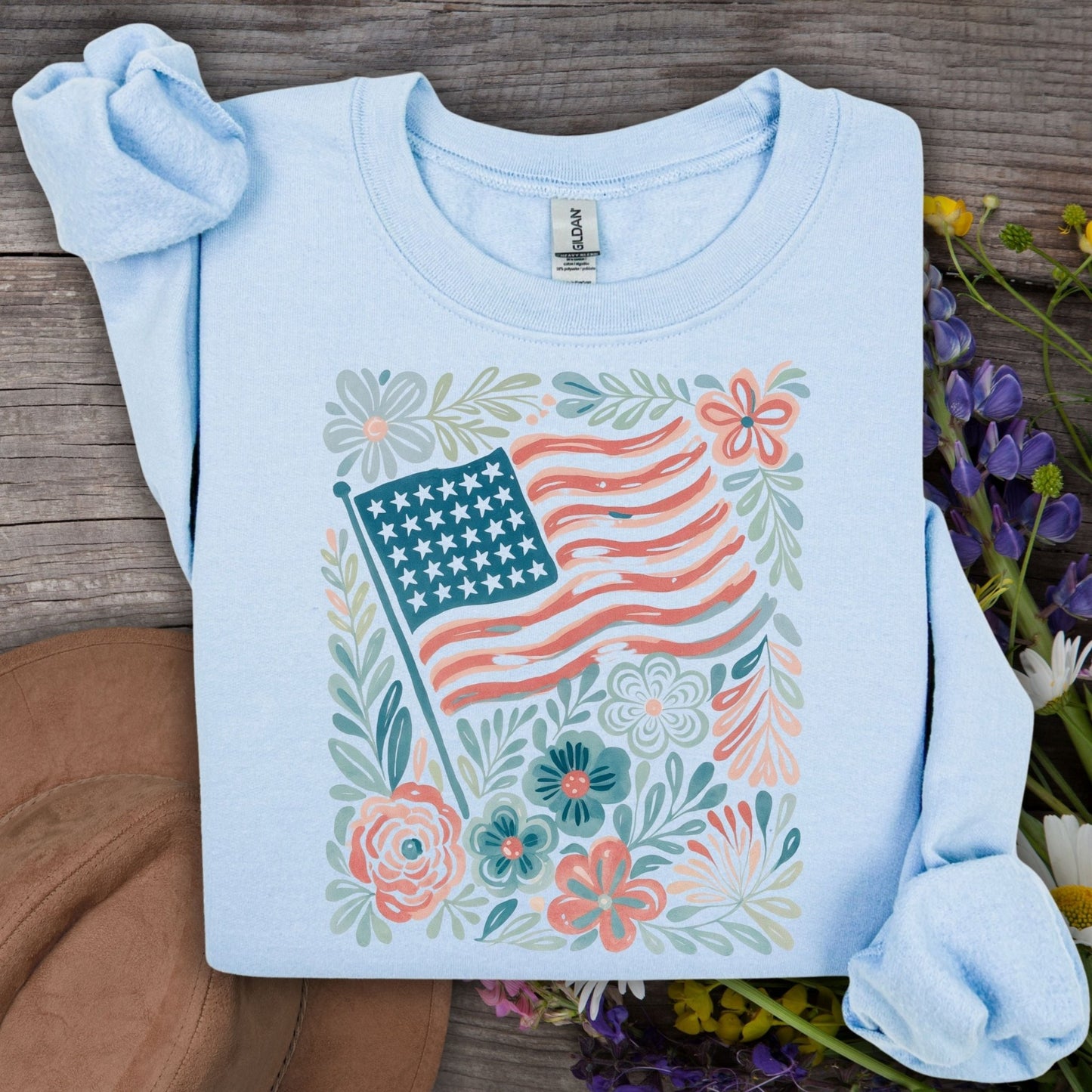 Light blue Gildan sweatshirt with a watercolor American flag and floral design.