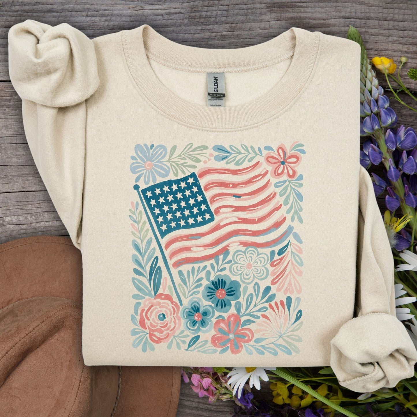 Sand American Flag & Flowers sweatshirt, a cozy crewneck with a watercolor patriotic floral design.