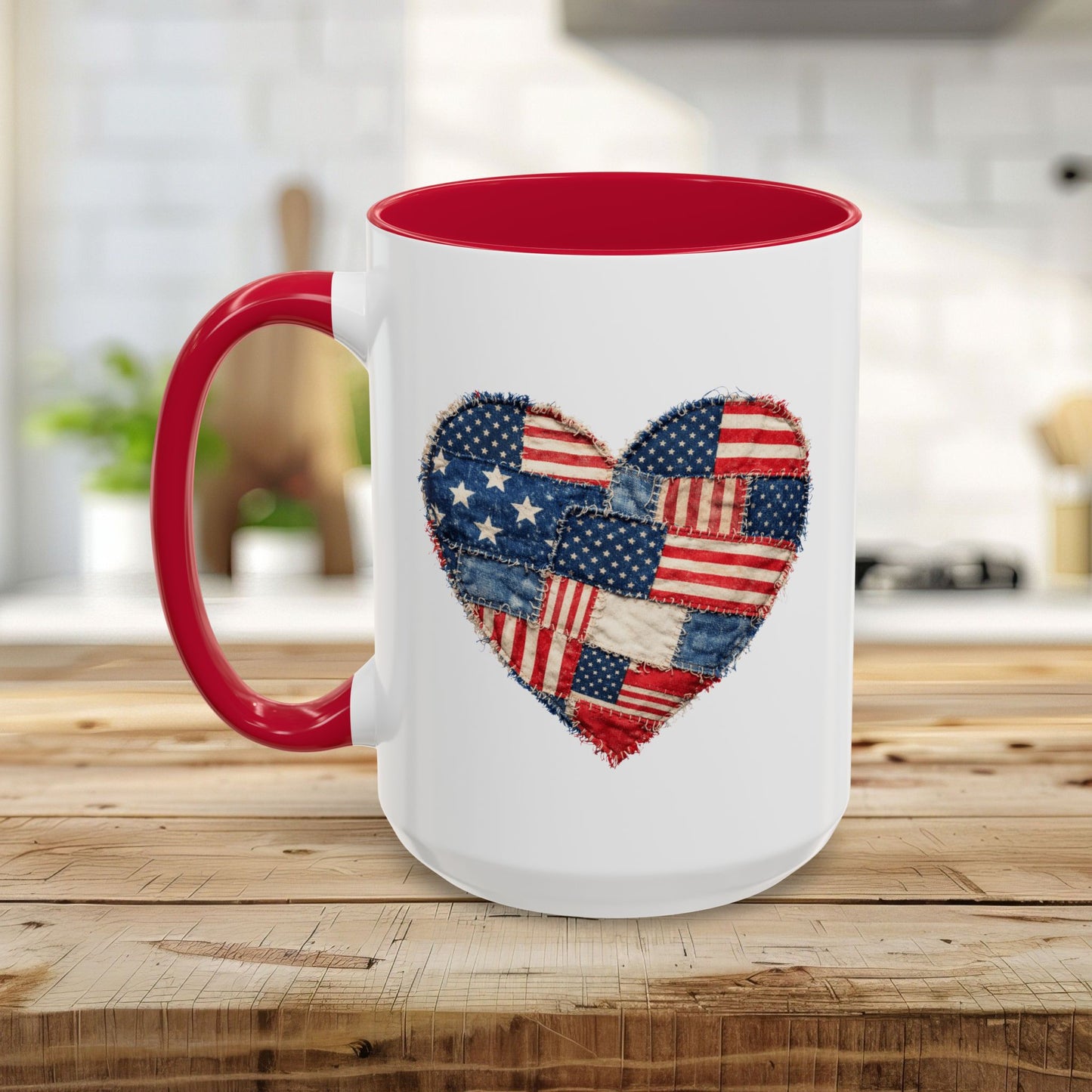 White ceramic mug with a red handle and interior, featuring a patchwork American flag heart design.